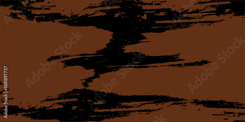 Abstract grunge background with a tree silhouette at sunset, casting a dark silhouette against the orange-red sky and clouds