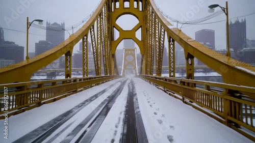 winter driving dolly shot of rachel carson bridge a forward over the yellow 9th street allegheny river in downtown pittsburgh 