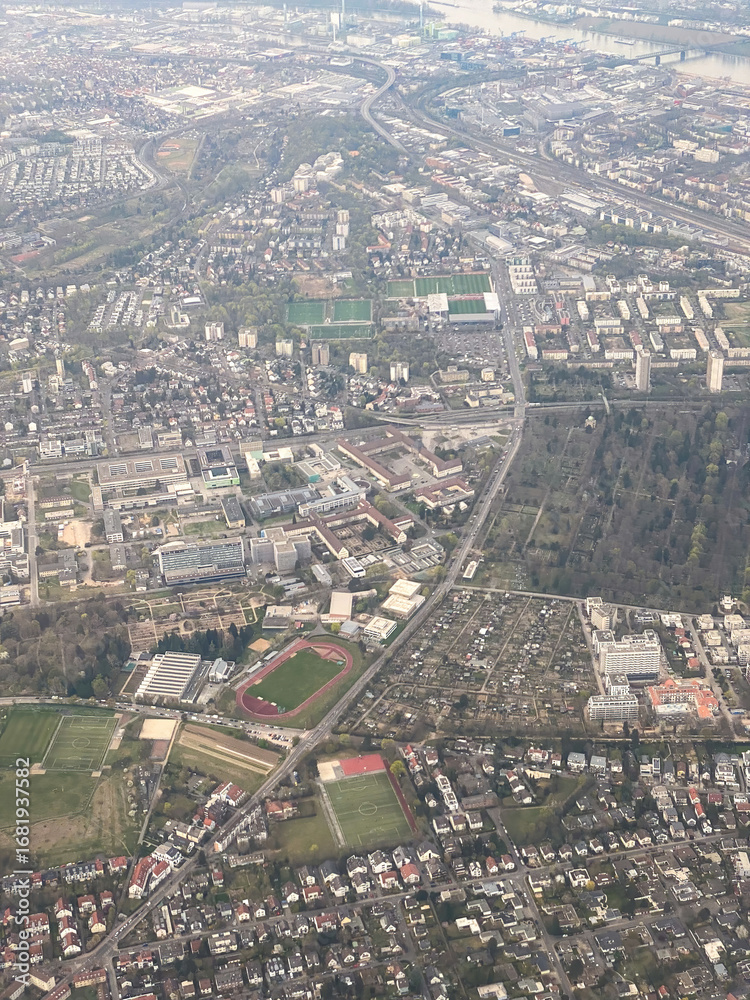 Fototapeta premium Aerial view of Mainz suburbs of Oberstadt, Hartenberg-Muenchfeld, Gonsenheim, Mombach, Neustadt and River Rhine, Germany