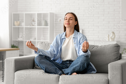 Young pretty woman meditati...