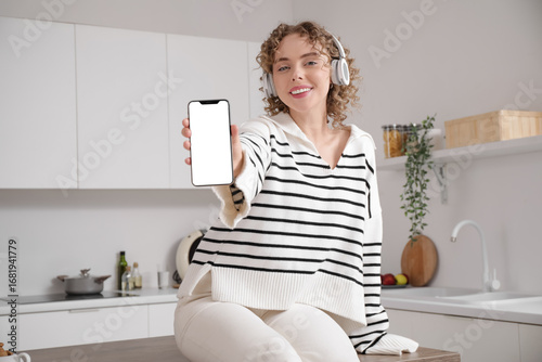 Young woman with headphones...