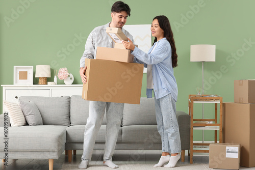 Young couple unpacking parc...