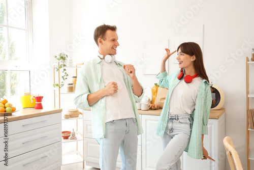 Young couple dancing in kit...