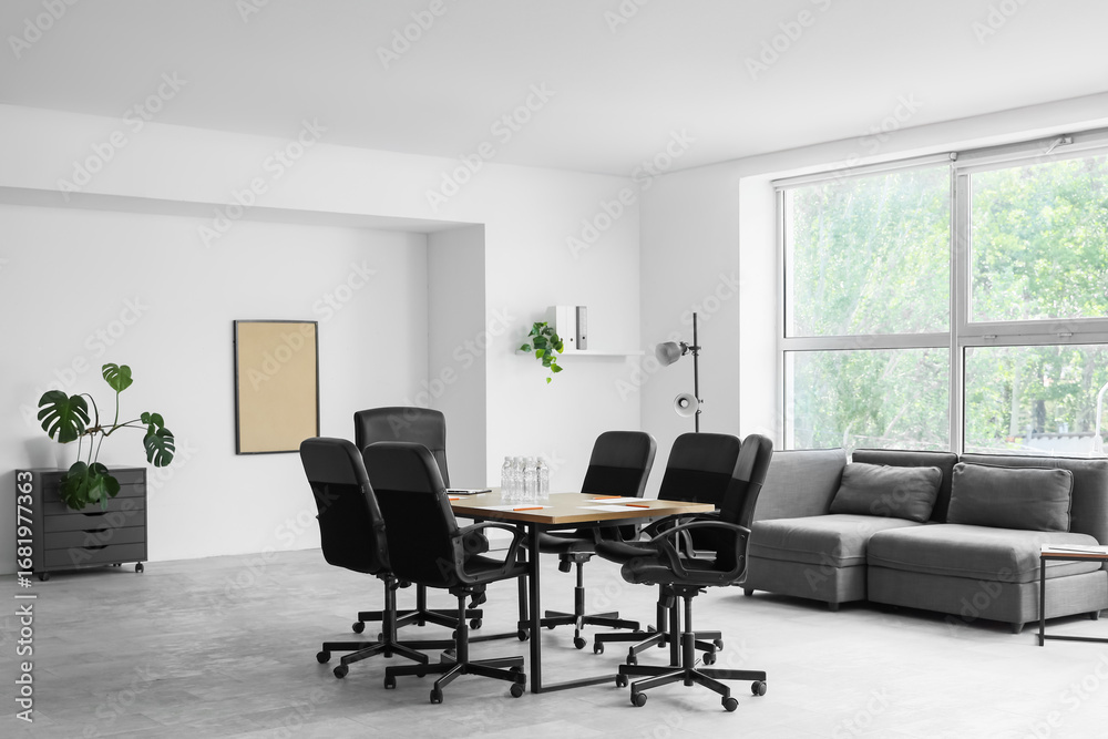 Fototapeta premium Interior of conference hall with table, lamp and sofa