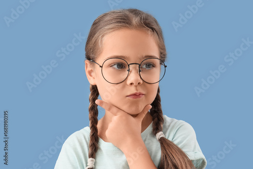 Thoughtful little girl in e...
