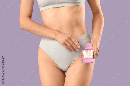 Young woman in panties with...