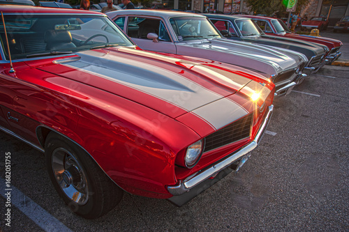 Vintage American muscle cars on display at show and shine.