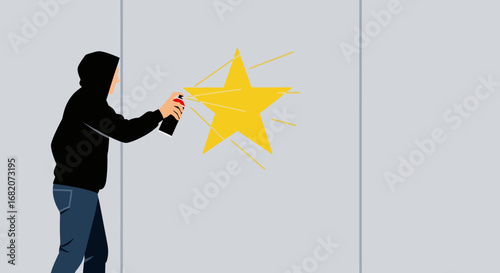 A person in a black hoodie sprays a yellow fivepointed star onto a light gray wall with a black and red spray can