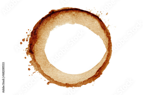 Circular coffee stain.  A perfect ring of light brown stain, with a dark center hole, against a black background.  Splashes and irregularities in the stain's outer edge