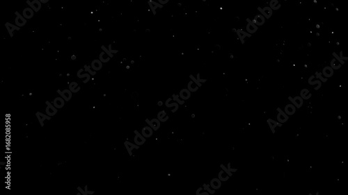 Natural Organic Dust Particles Floating On Black Background. Glittering Sparkling Particles Randomly Spin In The Air With Bokeh. Dynamic Particles With Fast And Slow Motion. Shimmering Dust In Space.	