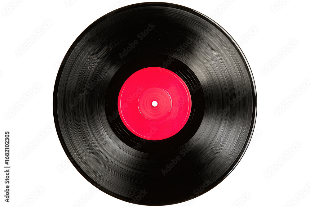 Fototapeta premium Close-up of a black vinyl record with a bright red label. The record's grooves are visible, creating a sense of motion. Dark background isolates the disc