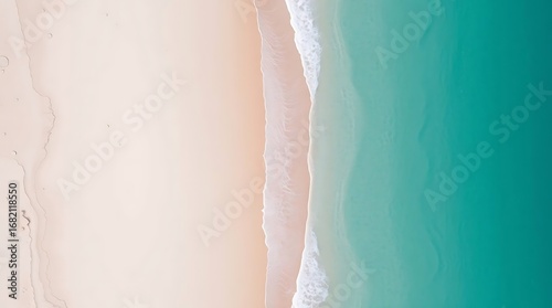 Serene aerial view captures soft pink sand meeting tranquil turquoise ocean waves, evoking peaceful coastal escape.