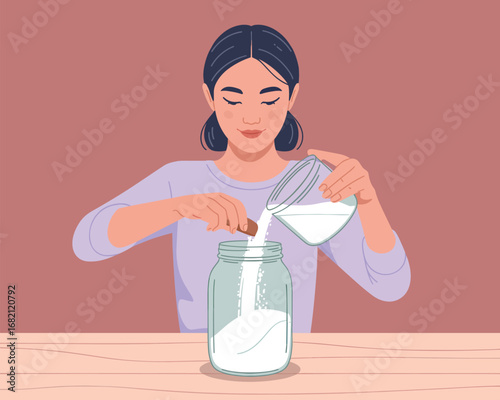 Young woman meticulously preparing a delightful homemade recipe, pouring fresh ingredients into a glass jar