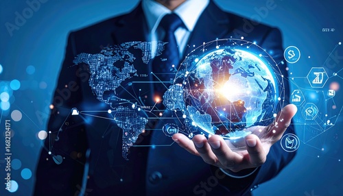 Man in a suit holding a glowing Earth hologram with world map and abstract digital icons against a blurred blue background, symbolizing global connection