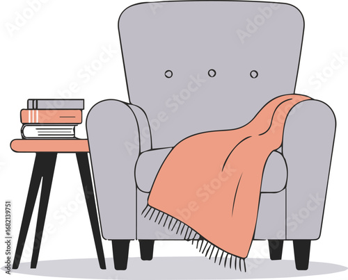 Cozy armchair with a stack of books and a warm blanket invites relaxation and reading