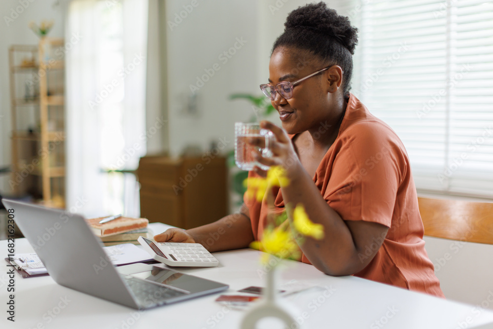 © David - Happy entrepreneur woman in glasses counting profit, on calculator at laptop computer, analyzing benefits, enjoying financial success, job high result.