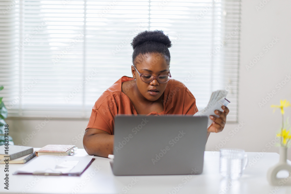 Fototapeta premium Unhappy woman feeling stressed calculating monthly expenses at home, facing financial problems or lack of money for utility household or rental payments, bankruptcy concept. 