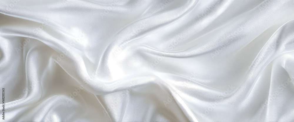 Fototapeta premium Soft, flowing white silk fabric, rippled and draped