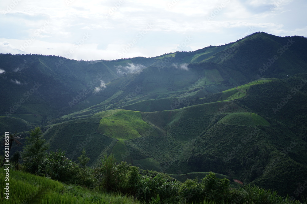 Naklejka premium mountain landscape with clouds