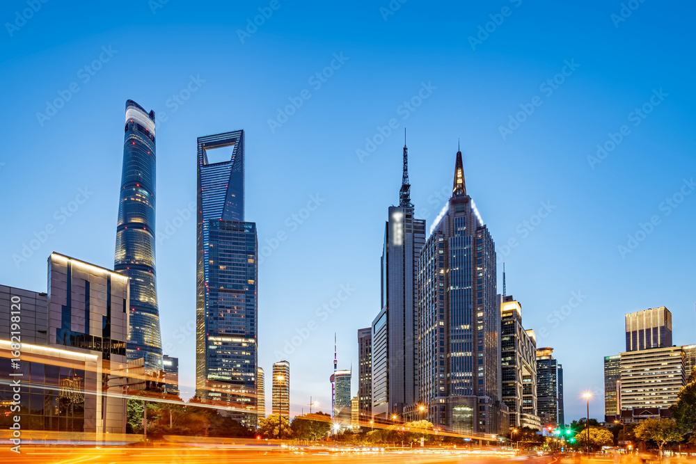 Fototapeta premium Modern city skyline with tall skyscrapers under clear blue sky