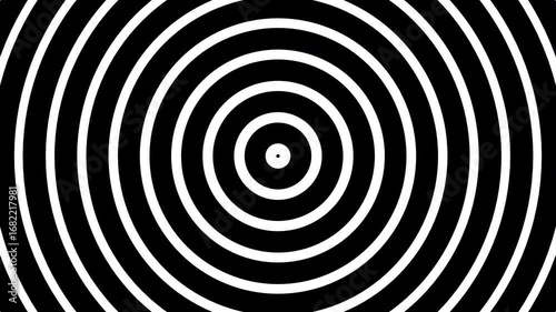 Hypnotic black and white spiral pattern, mesmerizing and intriguing design suitable for hypnotist posters or abstract backgrounds.