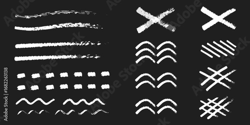Collection of hand drawn chalk brush strokes and graphic elements on a dark background