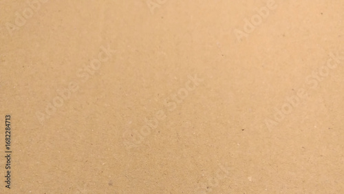 Background of brown kraft paper or cardboard texture, crumpled paper texture as a beige background