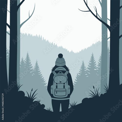 Silhouetted woman hiker gazes at winter mountain range in a tranquil forest.