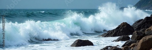 Ocean waves crashing on a rocky shore, sea foam and spray, dramatic coastal scene, powerful nature, water texture, dynamic energy , shadow, ocean