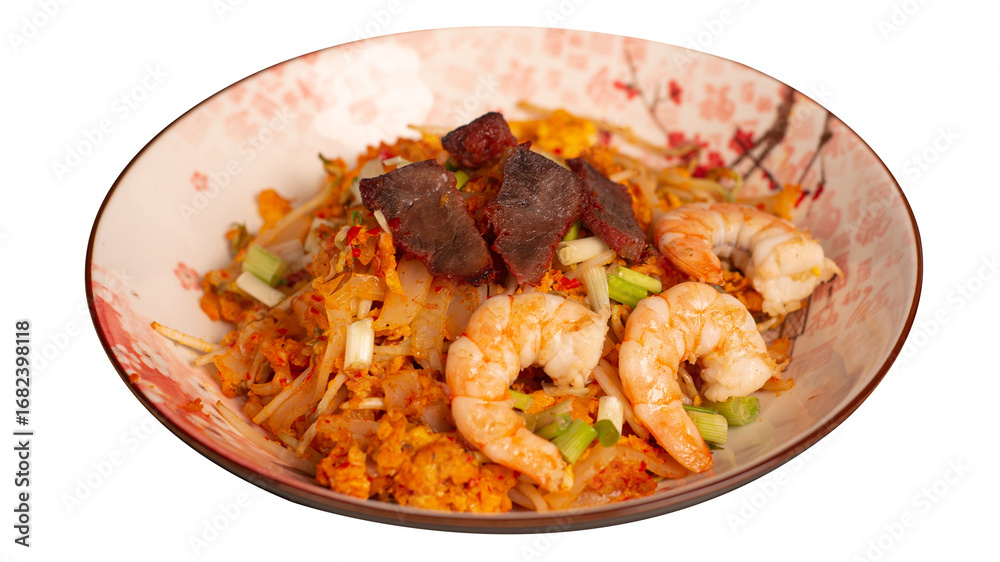 Fototapeta premium Stir fried kwetiau with shrimp and lapchiong. Served on brown stone plate. Transparant picture. Stir fried kwetiau with shrimp and lapchiong. Served on brown stone plate. Isolated from blac