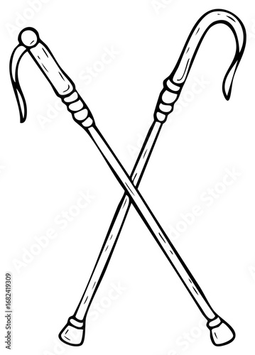 Crossed vintage walking canes with curved handles and textured grips