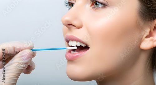 Medical Professional Taking a DNA Sample with an Oral Swab
