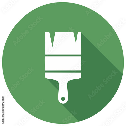 White paintbrush icon with long shadow on a green circle background