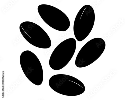 Minimalist black seeds scattered on white background creating modern abstract design