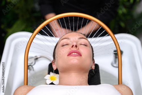 Spa therapy with water arc and flower accent