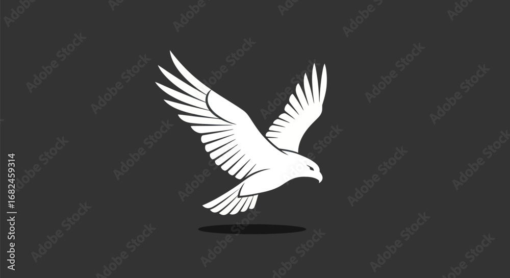 Obraz premium Majestic white eagle in flight with wings spread wide.