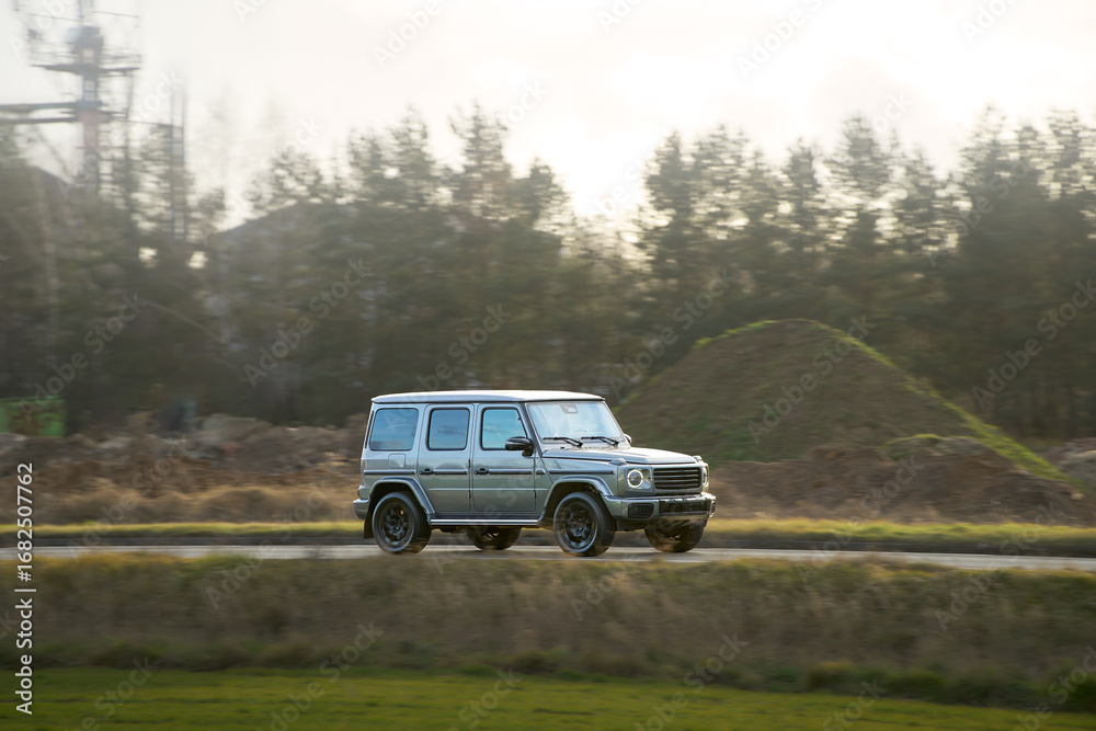 Fototapeta premium SUV on scenic drive through nature