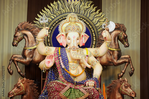 Canvas Print Ganesh idol with horses, Decorative Ganpati statue, Divine Ganesha sculpture, Artistic Ganesh festival decoration Stock Photo