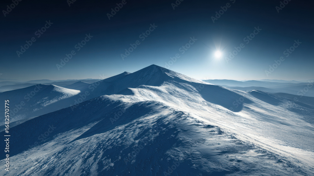 Naklejka premium Majestic snow covered mountains rise under clear blue sky, illuminated by bright sun. serene landscape evokes sense of tranquility and awe, showcasing nature beauty