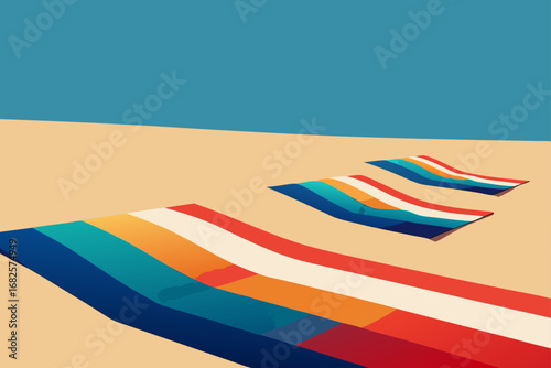 Vibrant striped beach towels laid out on a sandy shore under a clear blue sky