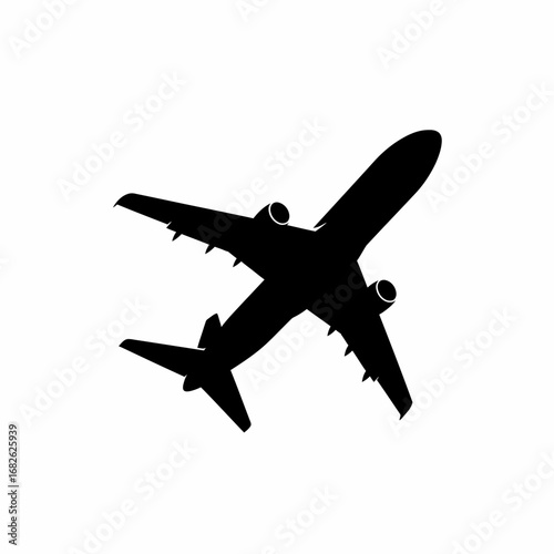 Black silhouette of a commercial airplane soaring through the sky, viewed from above.