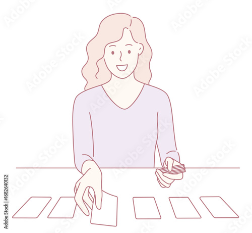 A woman is happily engaging in a card reading session with colorful tarot cards laid out on a table