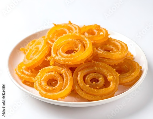 Jalebi, a popular Indian Sweet on a White Plate