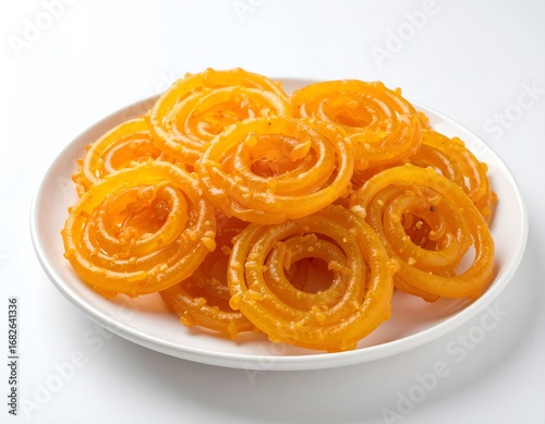 Jalebi, a popular Indian Sweet on a White Plate