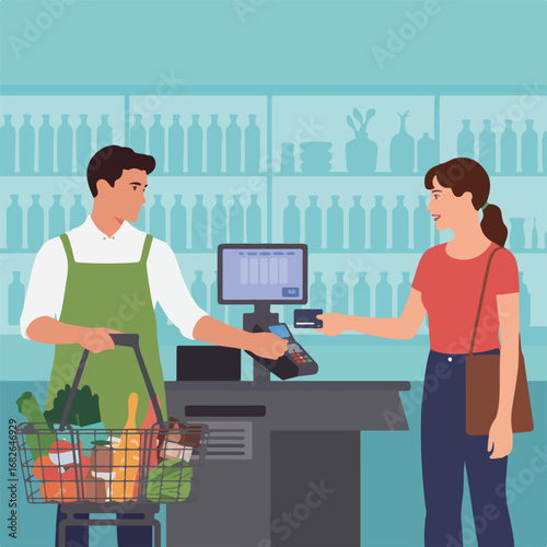Woman paying with credit card at the supermarket checkout counter