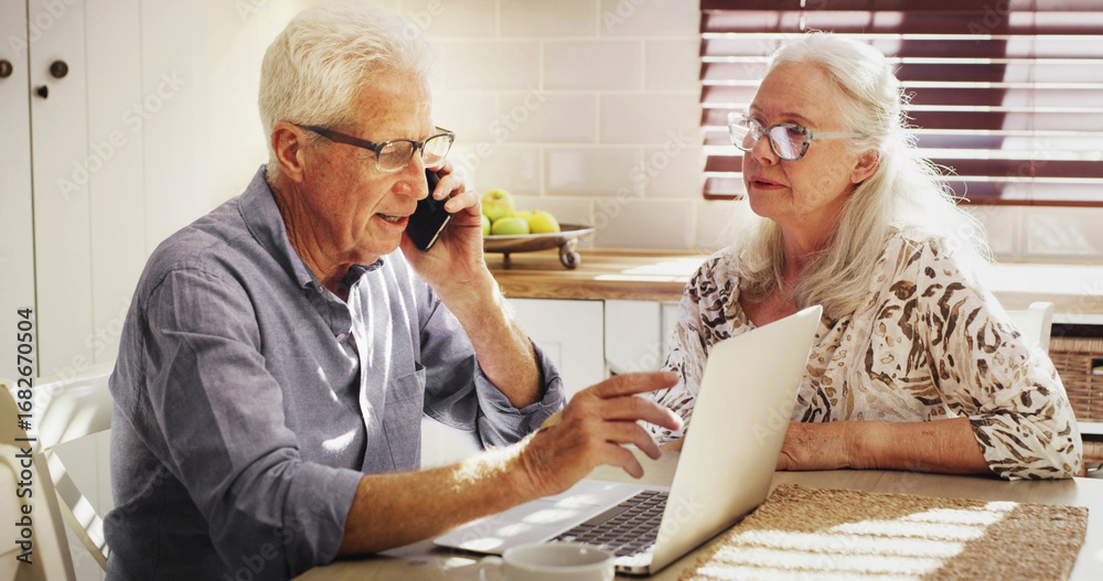Obraz premium Senior couple, laptop and phone call for finance, mortgage or talking for loan payment. Computer, man and woman on mobile for budget planning, pension savings or retirement expenses in home kitchen