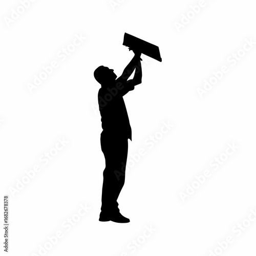 Silhouette of a man inspecting a roof leak during rainfall