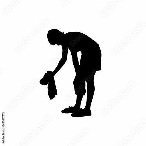 Silhouette of a person meticulously polishing shoes on a clean white background