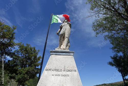 War memorial with Italian flag in Sant’Angelo in Grotte, Molise, Italy