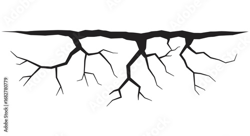 A black silhouette of tree roots growing underground